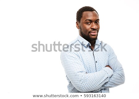 [[stock_photo]]: Handsome Young African Man Dressed In Shirt With Arms Crossed