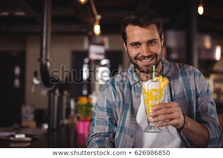 ストックフォト: Portrait Of Happy Man Having Milkshake