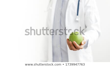 Foto stock: Professional Nutritionist Holding A Fresh Apple