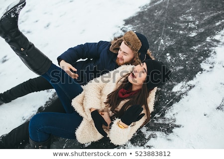 Foto d'archivio: Young Woman Rides Ice Skates In The Park