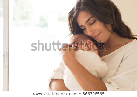 [[stock_photo]]: Young Mother Holding Her Baby Child Mom Nursing Baby
