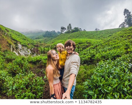 [[stock_photo]]: Mother And Son Are Traveling On A Tea Plantation In Malaysia Traveling With Children Concept