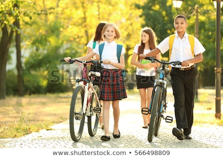 Foto stock: Cheerful Young African Teenager With Bicycle Outdoors