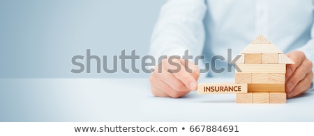 Stockfoto: Businessman Protecting Family Home