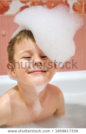 Imagine de stoc: Boy Bathing In Bathtub Full Of Foam Happy Child