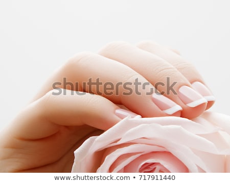 Stockfoto: Soft Selective Focus Beauty Nail Care Delicate Hands With Manicure Holding A Pink Petals Close Up