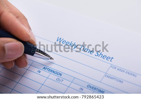 Zdjęcia stock: Persons Hand Filling Blank Weekly Time Sheet