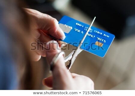 ストックフォト: Scissors Cutting Up A Credit Card
