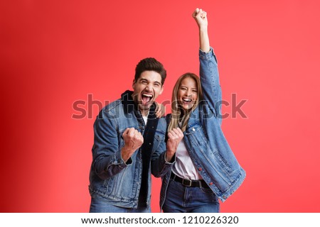 Stockfoto: Portrait Of A Cheerful Young Man Dressed In Denim Jacket