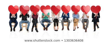 Сток-фото: Seated Smart Casual Woman Holds Big Love Heart