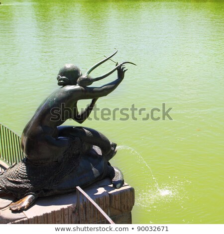 Stock photo: Madrid Sirena Con Lira Statue In Retiro Lake