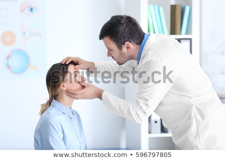 Foto stock: Doctor Examining Patients Eye