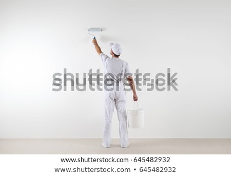 Stock photo: Man Painting A Wall