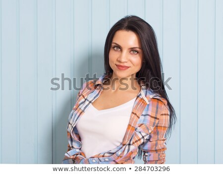 Stok fotoğraf: Female Model Aganst Textured Wall