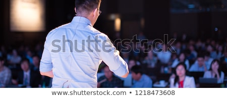 [[stock_photo]]: Speaker Giving Talk On Podium At Business Conference