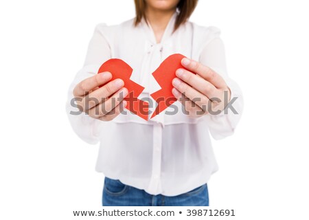 Imagine de stoc: Mid Section Of Woman Holding A Broken Heart