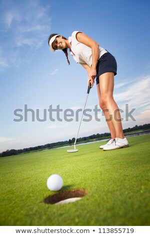 ストックフォト: Female Golfer Putting
