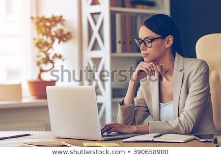 Stockfoto: Pensive Businesswoman With Hand On Chin