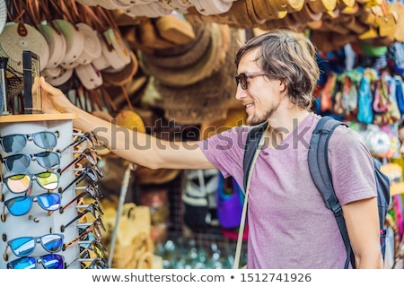 Zdjęcia stock: Man Traveler Choose Souvenirs In The Market At Ubud In Bali Indonesia