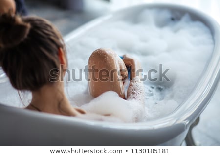 Foto stock: Young Woman Relaxing In A Sauna