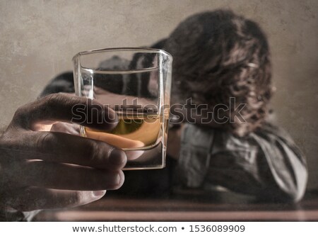 Foto d'archivio: Man With A Glass Of Whiskey Isolated