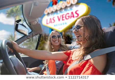 ストックフォト: Friends Driving In Convertible Car At Las Vegas