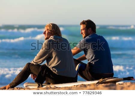 Two Surfers Talking On The Beach Stockfoto © Kzenon
