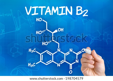 Zdjęcia stock: Hand With Pen Drawing The Chemical Formula Of Vitamin B2