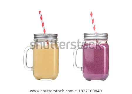 Foto stock: Green Kiwi Fruit Smoothie In Glass Jars With Straw Mint Leaf Cute Ripe Berry Close Up White Wood