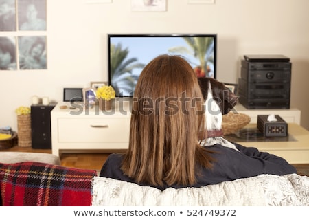 [[stock_photo]]: Woman And Dog Sitting Watching Tv