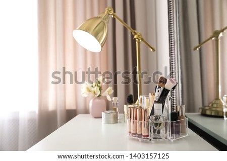 Stok fotoğraf: Cosmetics Makeup Products On Dressing Vanity Table Lipstick F