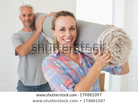 [[stock_photo]]: Couple Carrying Rug