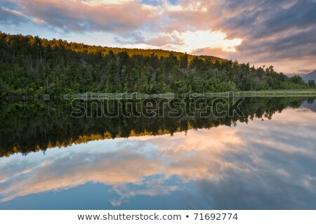 Sunrise Above A Lake On A Wind Still Morning Stock photo © 3523studio