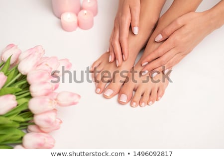 Stok fotoğraf: Feet And Toenails After Pedicure With Flowers