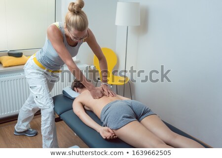 Stock photo: Pressure Massage On The Back During Physical Therapy Session