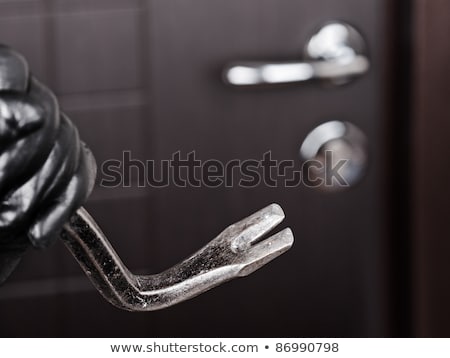 Zdjęcia stock: Burglar Hand Holding Crowbar Break Opening Door