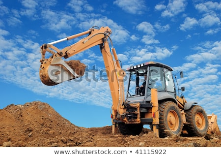 Foto stock: Excavator Loader With Backhoe Standing In Sandpit