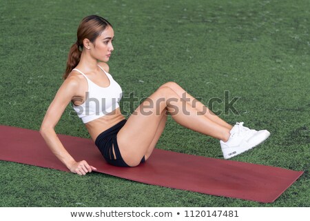 Stockfoto: Asian Woman Doing Crunches