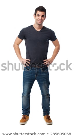 Foto stock: Portrait Of Handsome Young Man Standing On Black