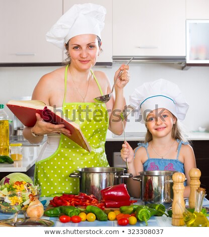 [[stock_photo]]: Portrait Of A Little Girl In Cook Clothes
