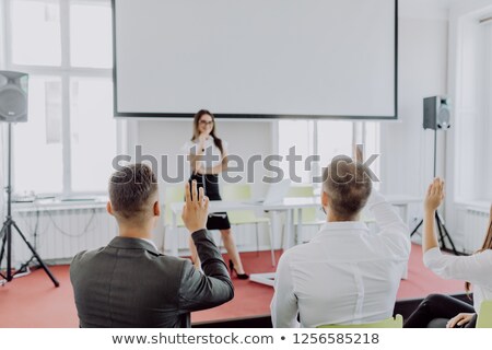 ストックフォト: Businessman Explaining Graph On Filpchart To Colleagues