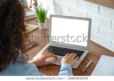 Stockfoto: Young Woman Sitting At Table With Laptop Computer