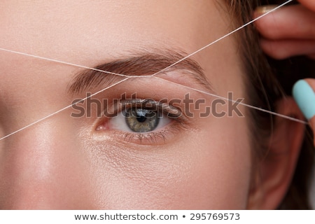 Stock fotó: Woman Correcting Eyebrows Form