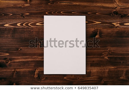Foto d'archivio: Blank White Paper A4 Envelope On Vintage Brown Wooden Board Mock Up For Branding Identity