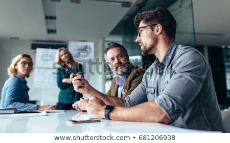 Foto stock: Coworkers Talking Over A Meeting