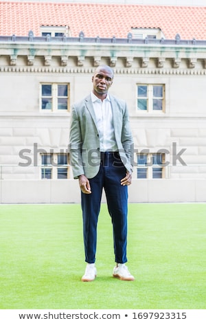 Foto d'archivio: Man In Gray Jacket Green Trousers Blue Shoes