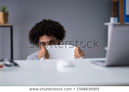 [[stock_photo]]: Frightened Businesswoman Hiding Behind Chair