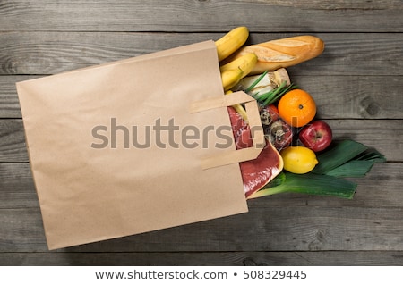 Foto stock: Grocering Concept Full Paper Bag Of Different Fruits