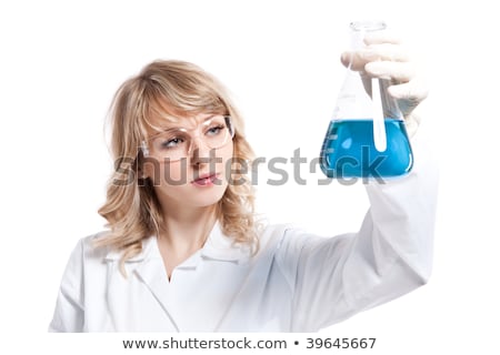 Foto stock: Female Scientist Holding Beaker