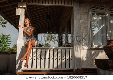 Stok fotoğraf: Summery Woman Sitting By A Tree